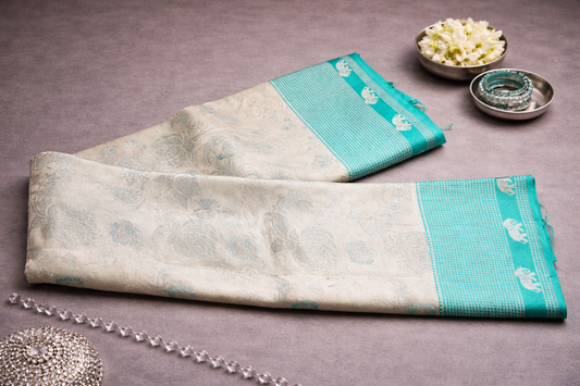 Beige Silk Saree with Turquoise Elephant Zari Border