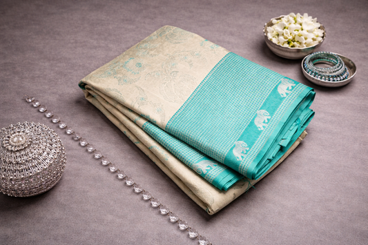 Beige Silk Saree with Turquoise Elephant Zari Border