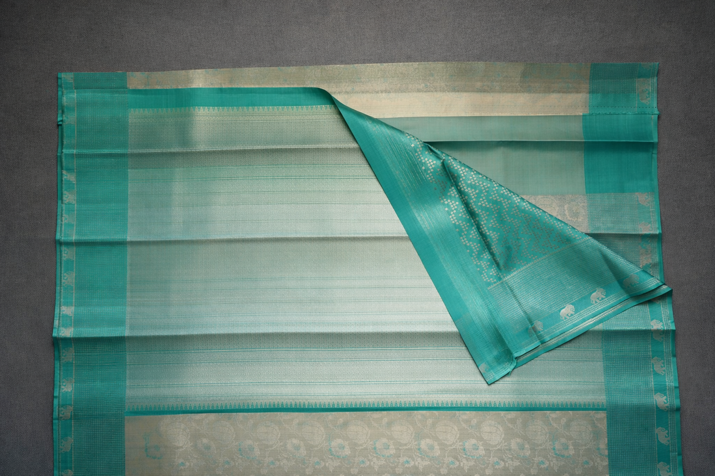 Beige Silk Saree with Turquoise Elephant Zari Border